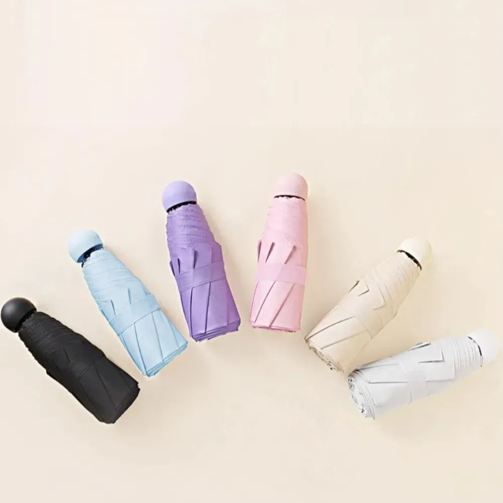 Mini Capsule Folding Umbrella UPF50+ – Portable Sun & Rain