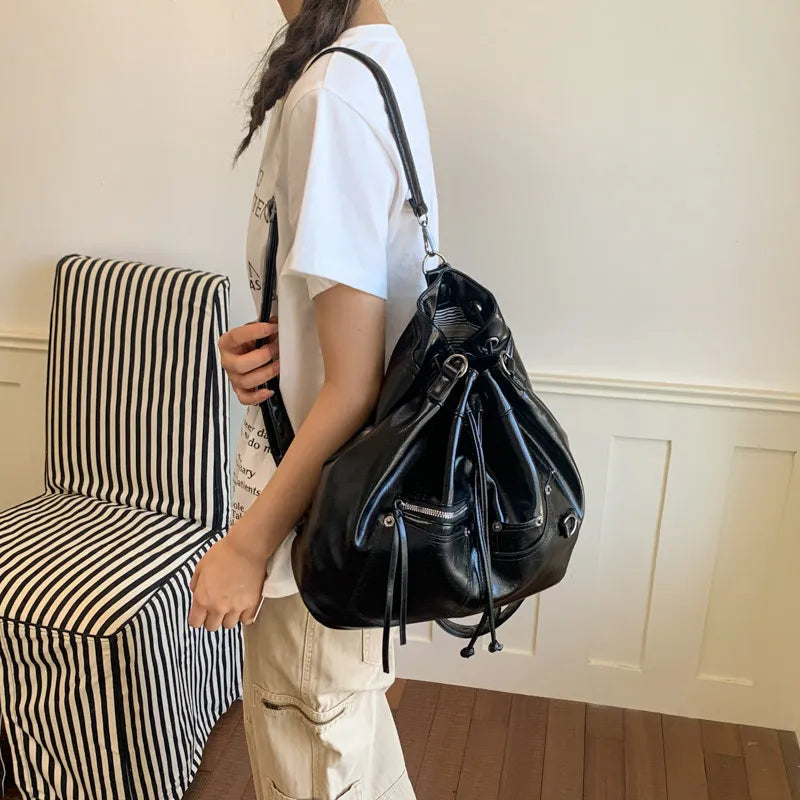Nixie Patent Leather Drawstring Bucket Crossbody Bag