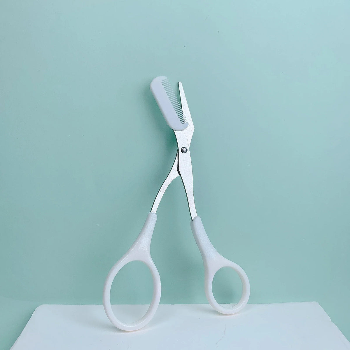 Pink Eyebrow Scissors with Built-In Comb – Stainless Steel