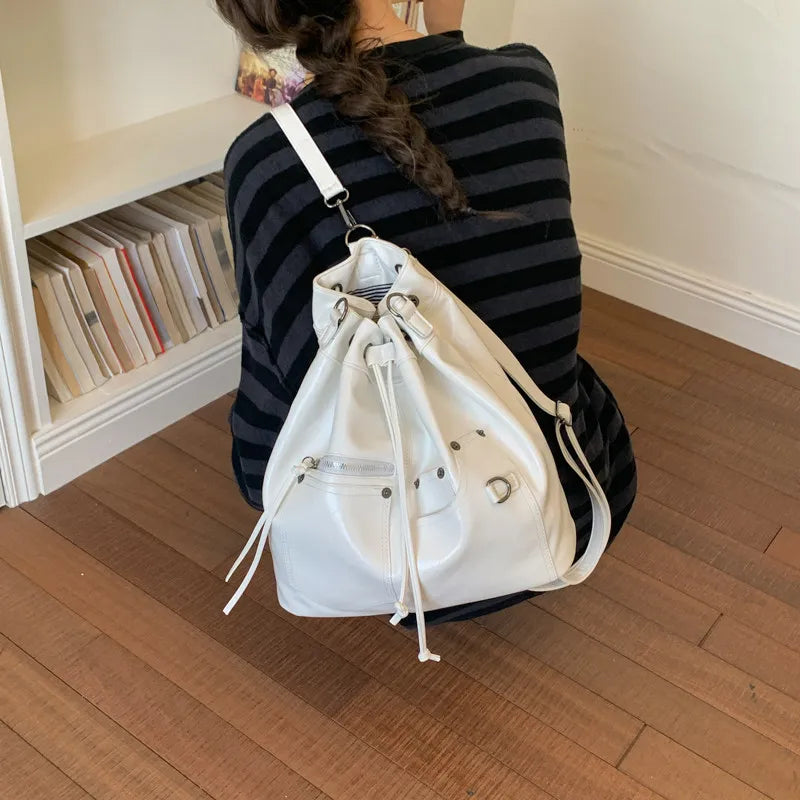 Nixie Patent Leather Drawstring Bucket Crossbody Bag